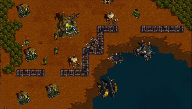 Warcraft 1 – strategická hra, pohled na orkské osady, hradby a lodě u pobřeží